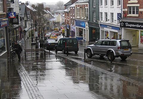 High streets suffered a bank holiday washout as heavy rain drove shoppers into shopping centres and retail parks during the extended weekend.