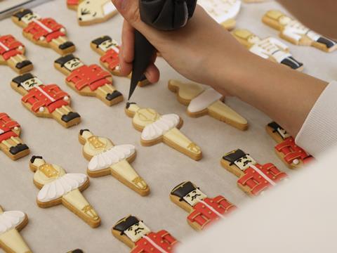 Icing a tray of biscuits