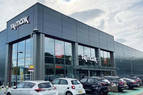 Busy TK Maxx retail clothing business shoppers & red shop front in