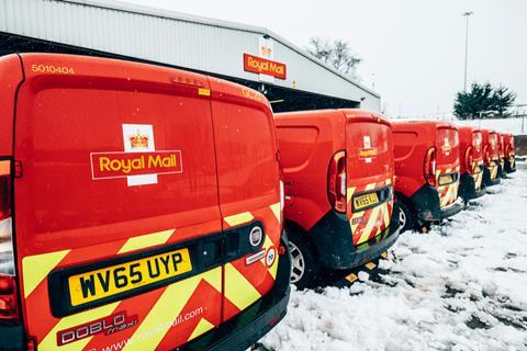 Post vans parked in snow