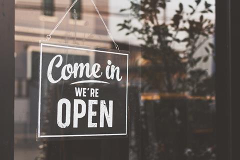 Shop sign reading 'come in we're open'