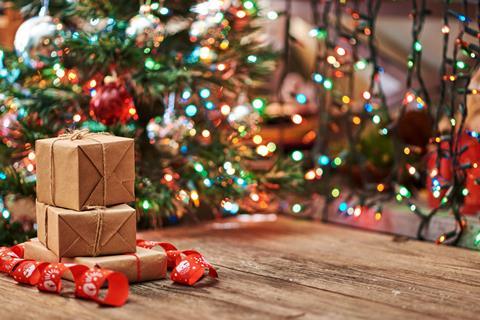 Packages in front of a Christmas tree