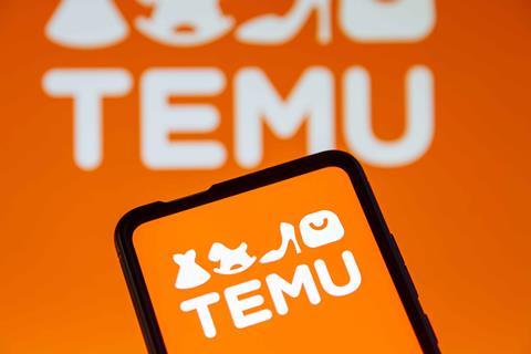 Temu logo on phone screen with Temu logo in background