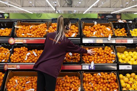 Sainsbury’s colleague working in fruit section