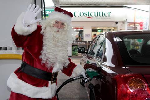 Santa grabbed his ho-ho-hose to help drivers re-fuel at Costcutter.