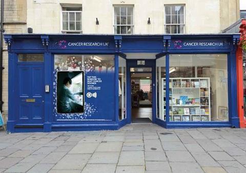 Cancer Research UK has teamed up with Clear Channel to bring contactless donation technology to four of the retailer’s UK shop windows