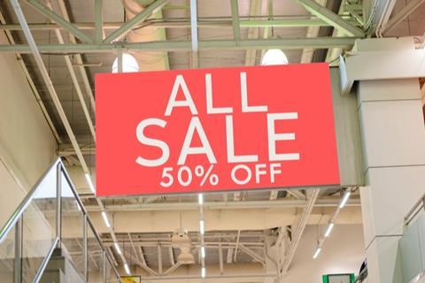 Half price sale sign in store