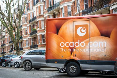 Ocado van outside a street of London red brick houses