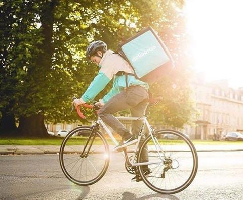 Deliveroo bike rider in the sun