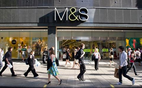 Marks & Spencer store with people walking past