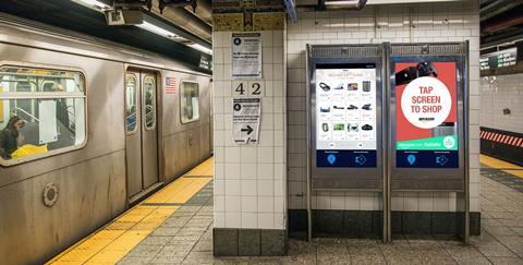 Amazon is launching transactional adverts on interactive digital kiosks on the New York subway over the Christmas period.